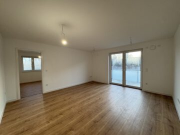 # IMMOTIONAL - KLIMAFREUNDLICHE NEUBAUWOHNUNGEN MIT BALKON IN BAD BEDERKESA - Wohnzimmer