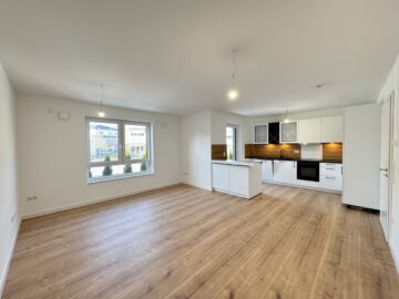 # IMMOTIONAL - KLIMAFREUNDLICHE NEUBAUWOHNUNGEN NACH QNG IN BAD BEDERKESA - WOHNUNG 1 - Wohnzimmer- und Küchenbereich